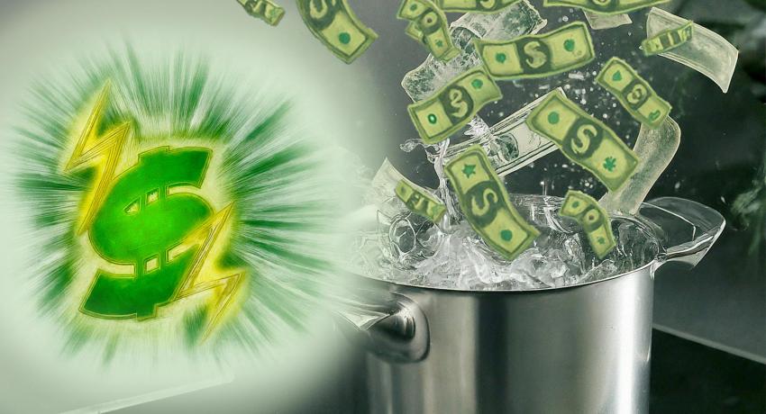 money flying into a boiling pot of water