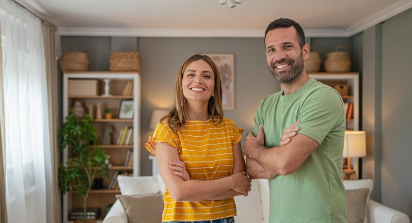 Smiling couple in living room