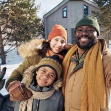 family out in the snow playing
