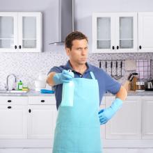 Man in apron looking into camera